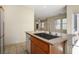 Modern kitchen features granite countertops, stainless steel appliances, and a convenient island at 1024 Larkspur Point Ct, Las Vegas, NV 89138