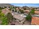 This aerial shot showcases the terracotta tile roofs of this lovely desert community, with mountain views at 11013 Mission Lakes Ave, Las Vegas, NV 89134