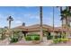 Community clubhouse showcasing desert landscaping, and neutral stucco with a terracotta tile roof at 11013 Mission Lakes Ave, Las Vegas, NV 89134