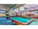 Spacious game room with multiple pool tables, ample lighting, and a relaxing atmosphere at 11013 Mission Lakes Ave, Las Vegas, NV 89134