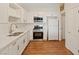Modern kitchen boasts white cabinets, stainless steel appliances, and granite countertops at 11013 Mission Lakes Ave, Las Vegas, NV 89134