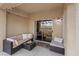 Cozy covered patio with comfortable seating, perfect for relaxing and enjoying the outdoor space at 11013 Mission Lakes Ave, Las Vegas, NV 89134