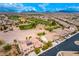 Panoramic aerial view of a community with golf course and mountain backdrop at 1172 Via Della Costrella, Henderson, NV 89011