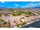 A neighborhood with well-maintained homes on a golf course under a bright blue sky at 1172 Via Della Costrella, Henderson, NV 89011