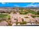 Scenic aerial view of homes situated on a golf course with a beautiful mountain backdrop at 1172 Via Della Costrella, Henderson, NV 89011