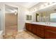 Double vanity bathroom with view to bedroom space at 1172 Via Della Costrella, Henderson, NV 89011