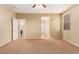 Spacious bedroom with carpet flooring, and doorways to the bathroom and closet at 1172 Via Della Costrella, Henderson, NV 89011