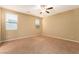 Spacious bedroom with neutral walls, carpet flooring, and natural light from windows at 1172 Via Della Costrella, Henderson, NV 89011