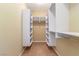 Walk-in closet with built-in shelving and organizers for efficient storage and organization at 1172 Via Della Costrella, Henderson, NV 89011