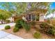Landscaped home with stone accents, desert landscaping and a two-car garage at 1172 Via Della Costrella, Henderson, NV 89011