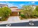Charming single-Gathering home with a two-car garage and desert landscaping at 1172 Via Della Costrella, Henderson, NV 89011