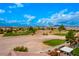 Expansive golf course view with green grass and desert landscape on a sunny day under a bright blue sky at 1172 Via Della Costrella, Henderson, NV 89011