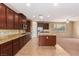 Well-equipped kitchen with granite countertops and tile flooring at 1172 Via Della Costrella, Henderson, NV 89011