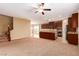 Open-concept kitchen with modern appliances, a center island, and ample counter space overlooking large living area at 1172 Via Della Costrella, Henderson, NV 89011