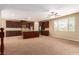 Open-concept kitchen with modern appliances, a center island, and ample counter space overlooking large living area at 1172 Via Della Costrella, Henderson, NV 89011