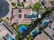 Aerial view of a modern estate featuring a pool, spa, outdoor living space and a basketball court at 12119 Castilla Rain Ave, Las Vegas, NV 89138