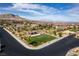 An aerial view of a community featuring custom homes and mountain views at 12119 Castilla Rain Ave, Las Vegas, NV 89138