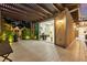 Back patio with sitting area and glass door to office at 12119 Castilla Rain Ave, Las Vegas, NV 89138