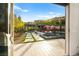 A backyard oasis featuring multiple seating areas, water features, and lush landscaping visible from inside the home at 12119 Castilla Rain Ave, Las Vegas, NV 89138