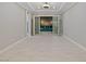 Neutral bonus room with tile floors, recessed lights and double doors to the backyard at 12119 Castilla Rain Ave, Las Vegas, NV 89138