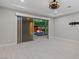 Spacious bonus room featuring tile floors and an outdoor entertaining area with a fire pit at 12119 Castilla Rain Ave, Las Vegas, NV 89138