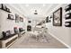 Versatile bonus room featuring a white piano, stylish seating, and curated wall decor at 12119 Castilla Rain Ave, Las Vegas, NV 89138