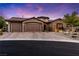 Charming home with a three-car garage and well-maintained landscaping at sunset at 12119 Castilla Rain Ave, Las Vegas, NV 89138