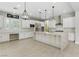 Bright, open kitchen featuring an oversized island, modern stainless appliances, and lots of counter space at 12119 Castilla Rain Ave, Las Vegas, NV 89138