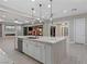 Bright, open kitchen featuring an oversized island, modern stainless appliances, and lots of counter space at 12119 Castilla Rain Ave, Las Vegas, NV 89138