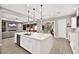 Spacious kitchen featuring a central island with access to the living and dining areas at 12119 Castilla Rain Ave, Las Vegas, NV 89138