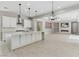Bright, open kitchen featuring an oversized island, modern stainless appliances, and lots of counter space at 12119 Castilla Rain Ave, Las Vegas, NV 89138