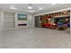 Spacious living room with fireplace, backyard view, and sliding doors to outdoor living area at 12119 Castilla Rain Ave, Las Vegas, NV 89138