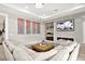 Cozy living room with a fireplace and comfortable seating at 12119 Castilla Rain Ave, Las Vegas, NV 89138