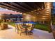 Cozy backyard patio with outdoor dining set and basketball court at 12119 Castilla Rain Ave, Las Vegas, NV 89138