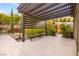Serene patio area featuring comfortable seating, lush landscaping, and a sauna at 12119 Castilla Rain Ave, Las Vegas, NV 89138