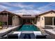 Beautiful pool featuring comfortable lounge seating, a fire pit, and a covered patio at 12119 Castilla Rain Ave, Las Vegas, NV 89138