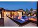 Stunning pool with built-in lounge chairs and a fire feature, extending the living space outdoors at 12119 Castilla Rain Ave, Las Vegas, NV 89138