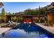 Inviting backyard pool area with comfortable seating and lush landscaping, perfect for relaxation and entertaining at 12119 Castilla Rain Ave, Las Vegas, NV 89138