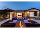 Luxurious backyard pool with stylish lounge chairs and a fire feature, creating a serene outdoor oasis at 12119 Castilla Rain Ave, Las Vegas, NV 89138