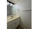 Bathroom with a large mirror and vanity with a cream-colored countertop at 1474 Santa Anita Dr # B, Las Vegas, NV 89119