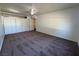 Spacious carpeted bedroom offering ample closet space and featuring neutral walls and a ceiling fan at 1474 Santa Anita Dr # B, Las Vegas, NV 89119