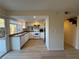 Bright kitchen features wood flooring with white cabinets and stainless steel appliances at 1474 Santa Anita Dr # B, Las Vegas, NV 89119
