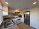 Well-lit kitchen with white cabinets, stainless steel fridge, and ample countertop space at 1474 Santa Anita Dr # B, Las Vegas, NV 89119
