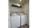 Close-up of the laundry closet containing a standard-size washer and dryer at 1474 Santa Anita Dr # B, Las Vegas, NV 89119