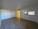 Open concept living area showcasing wood-look floors and a view into the kitchen at 1474 Santa Anita Dr # B, Las Vegas, NV 89119