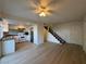 Bright living room features wood flooring and an open floor plan to the kitchen and staircase at 1474 Santa Anita Dr # B, Las Vegas, NV 89119
