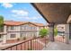 Balcony view of apartment complex with desert landscaping and neutral stucco buildings at 1575 W Warm Springs Rd # 121, Henderson, NV 89014