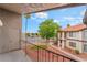 Balcony view of neutral colored condos with red tile roofs and desert landscaping at 1575 W Warm Springs Rd # 121, Henderson, NV 89014
