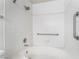Bathroom featuring a tiled shower and grab bars at 1575 W Warm Springs Rd # 121, Henderson, NV 89014