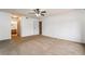 Bedroom features neutral carpeting and a ceiling fan at 1575 W Warm Springs Rd # 121, Henderson, NV 89014